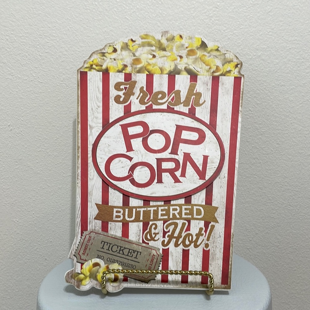 fresh popcorn buttered and hot sign